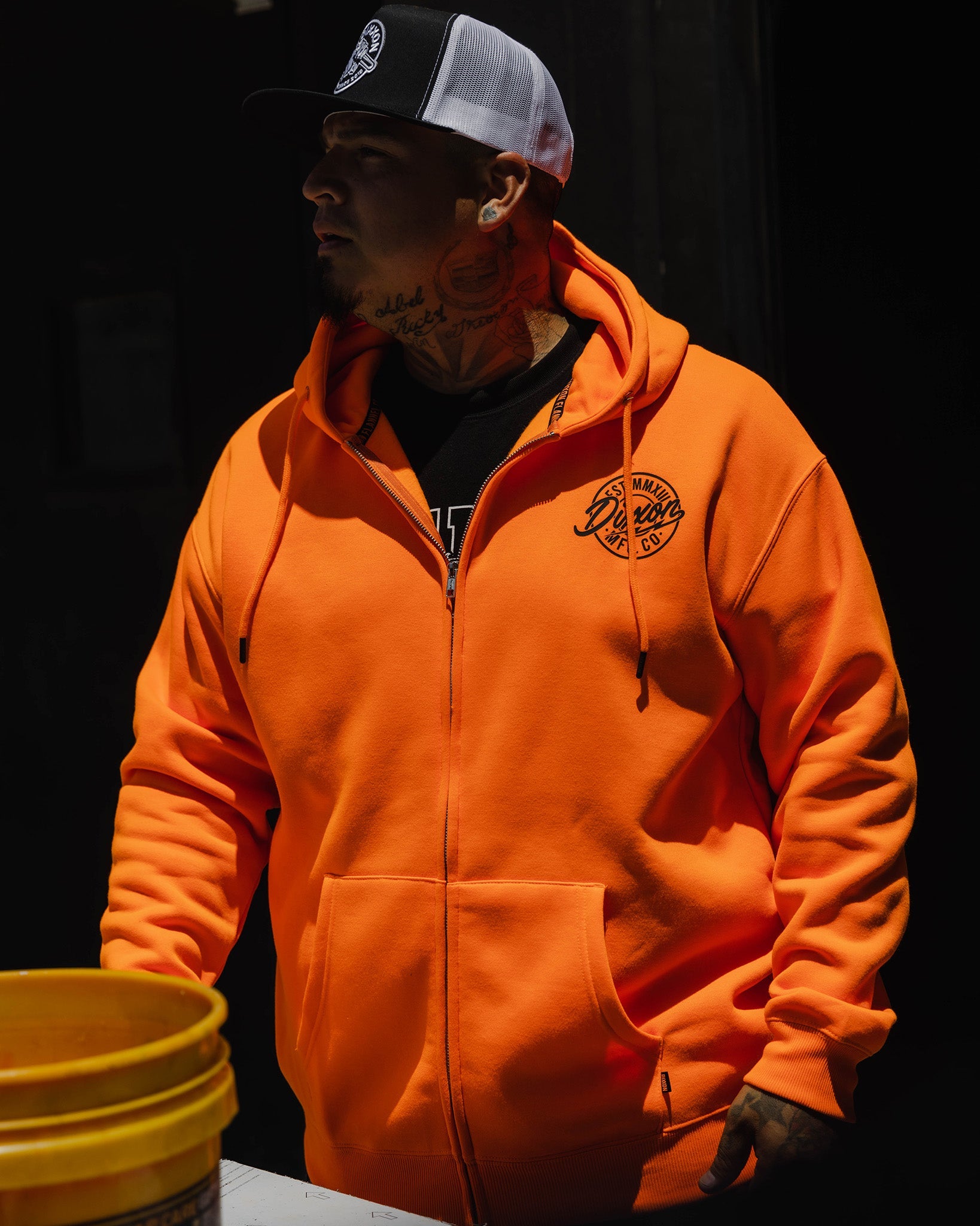 Dixxon Safety Orange Hoodie: Black MFG Badge & Style