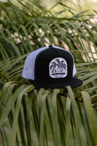 Dueling Palms Flat Bill Trucker Snapback- White & Black - Dixxon Flannel Co.